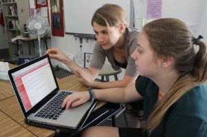 Ms. Taylor assists Voice's Editor Syd Stone '16.  Photographer: Rosemarry Patron '16