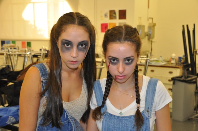 Two seniors prepare to scare the rest of the student body. 
Photo by Isabella Fuchs 14