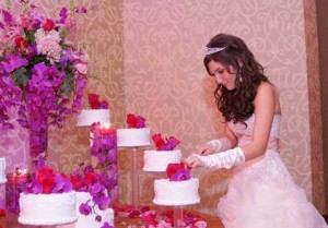 A girl makes the first cake cut on her Quinceañera Source: pinterest.com/rockme16/quinceanera/ 