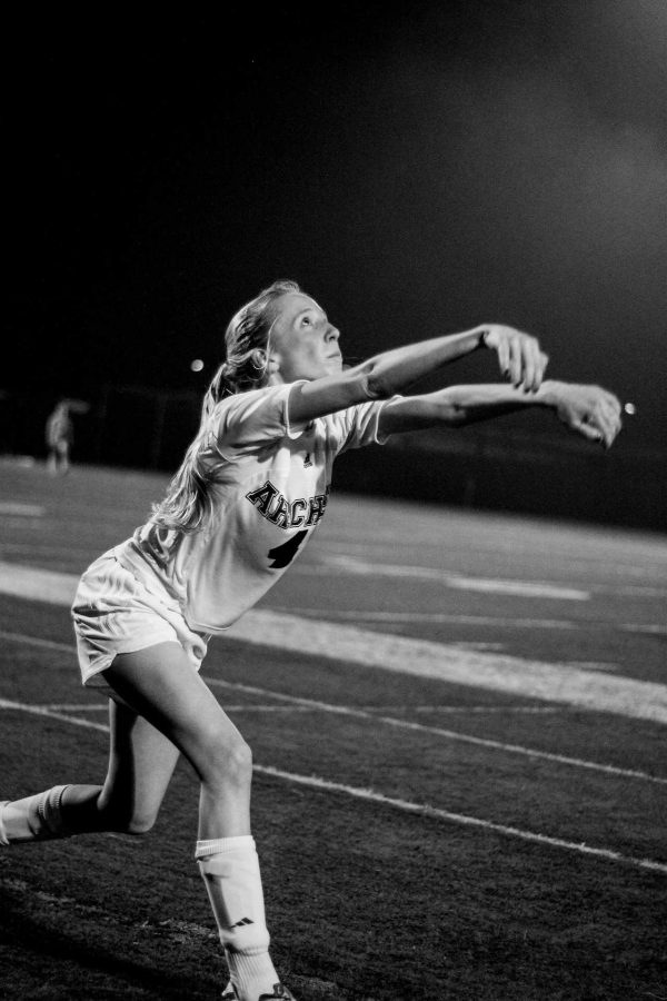 Defender Leandra Ramlo 16 takes a throw-in.