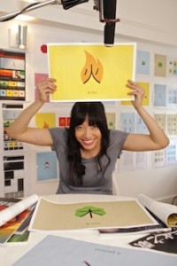 Shaolan Hsueh poses with an example of one of her character images. Courtesy of chineasy.org