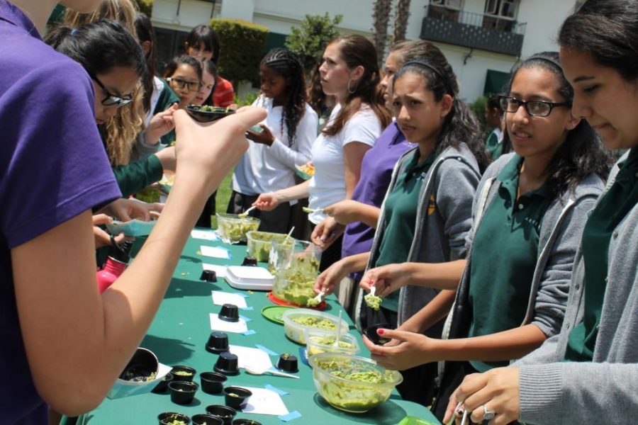 Contestants serve their guacamole to some eager Archer girls. Photographer: Zoe Pelikan 17.