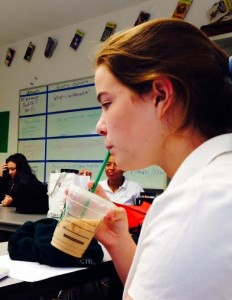 Ali Kiley '16 drinking an iced latte.