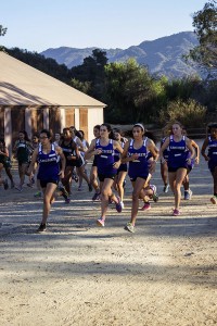 Varsity Cross Country takes off from the starting gate at the beginning of the race. Captains Yasmeen Namazie '15 and Layla Masotta '15 led their team to a second place victory. Photographer: Shishi Shomloo '15