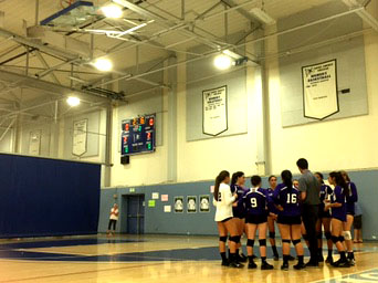 Varsity team makes good use of timeout and discusses next play. Photographer: Haley Kerner 16