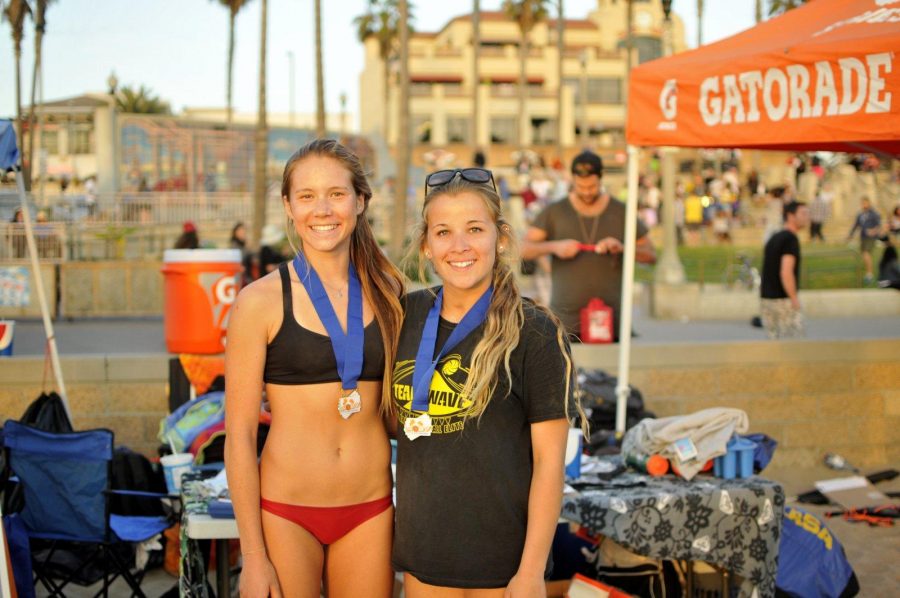 Alyssa Slagerman 16 poses with one of her beach partners Presley Forbes after taking second place in  the Get Notice Beach Volleyball tournament in February 2015. 