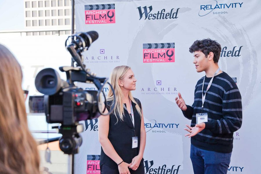 Chanel Williams 14 interviews a student filmmaker at the 2014 Archer Film Festival held at AMC Century City. Students at Archer have the opportunity to take film classes at Archer in Upper School. Photographer: Dan In