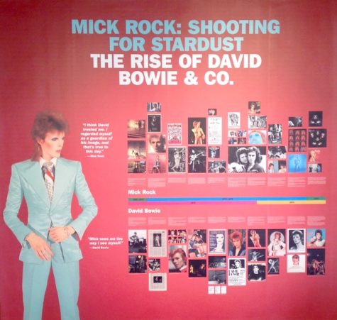 A timeline of images on a wall inside the exhibit showcased the major events of David Bowie's life. David Bowie was known for his odd persona, freedom of expression, wacky costumes, makeup and sexual ambiguity. 