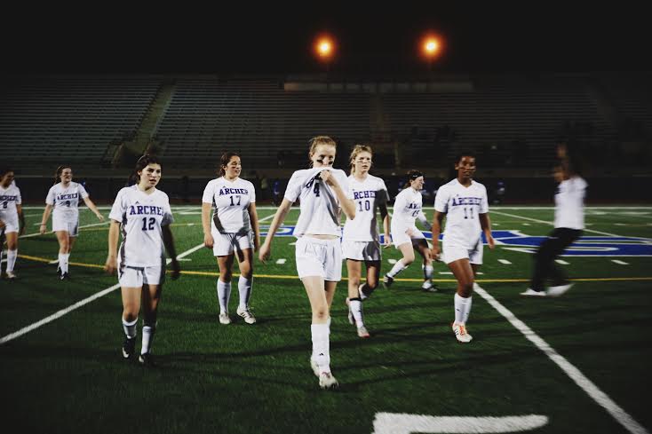 The 2015-2016 varsity soccer team walks off the field at halftime during their Jan. 22 game against Pacifica Christian. The team went on to win the game 3-0. Photo by Meghan Marshall 17.