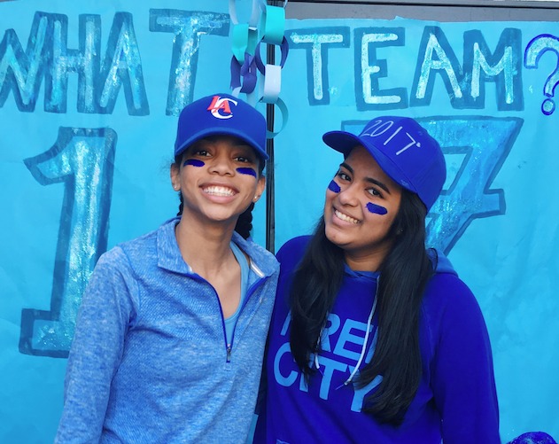 Alyssa Downer 17 and Anika Bhavnani 17 celebrate Color Wars in the Courtyard. They showed off their blue spirit with sweatshirts, face paint and caps; Bhavnani made hers. Image courtesy of Bhavnani.