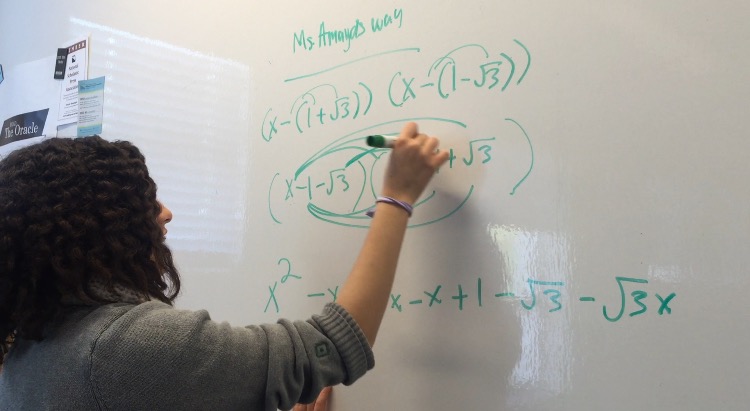 Iman Mohammed 18 solves polynomials with irrational roots using the method traditionally taught in school. Photo by Carina Oriel