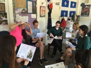 French teacher Dr. Valerie Yoshimura reads Alice in Wonderland in French with her French 4 class. Photo By: Logan Connors '17