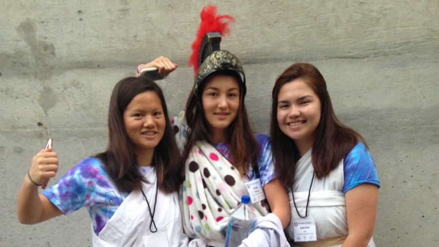 From left to right, Saskia Wong-Smith 18, Portia Freeman 18 and Gabriela Lu 18 prepared for the spirit competition. They wore Roman themed togas and helmets. 