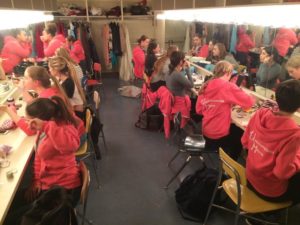 The Unaccompanied Minors prepare for their performance backstage. Photographer: Kate Burns.