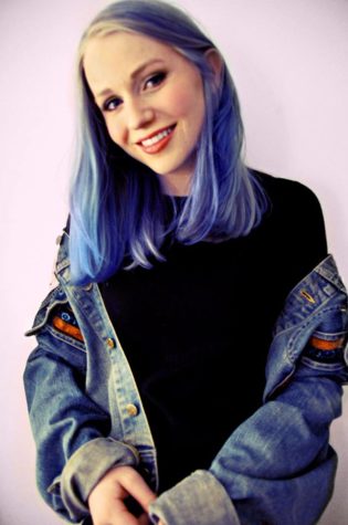 Sara Seaman '16 with blue hair. Seaman usually dyes her hair abnormal colors during the summer. Photo courtesy of Seaman.