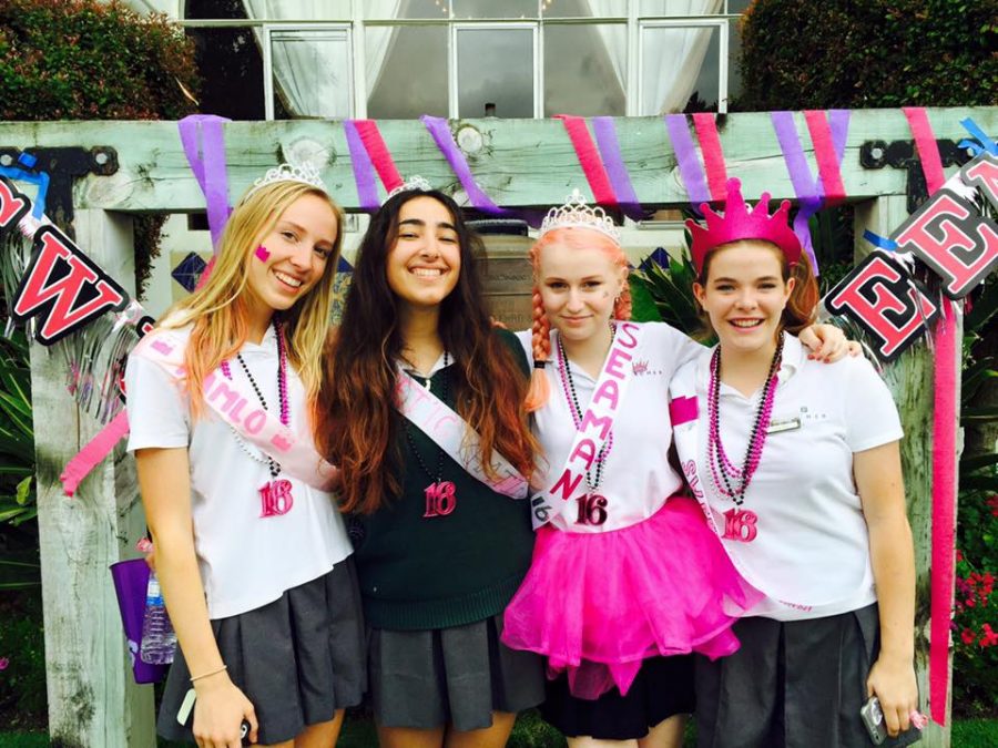 Sara Seaman 16 poses with three friends on Moving Up Day. Seaman is pictured in bubble-gum pink hair, which is not allowed under Archers current policy. Seaman believes being an Archer girl and having pink hair should not be mutually exclusive. Photo courtesy of Ali Kiley 16.