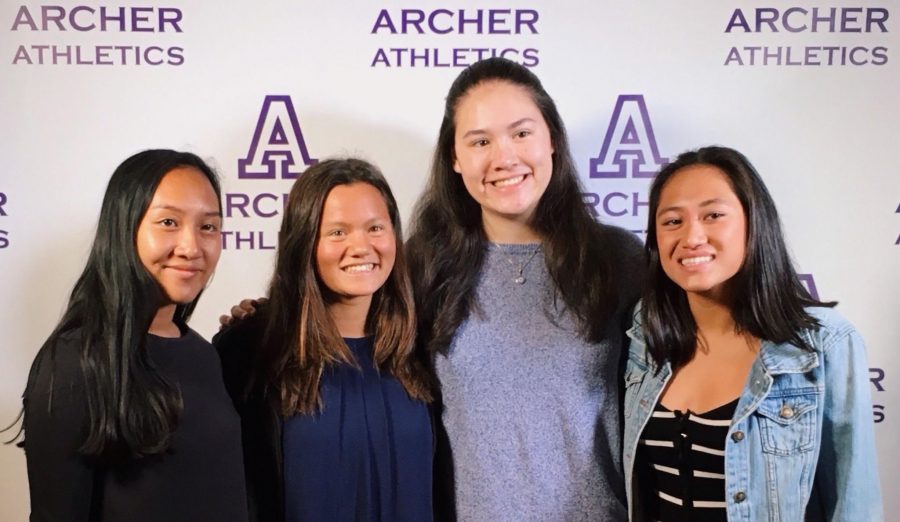 From left to right, Cat Oriel, Saskia Wong-Smith, Cybele Zhang and Summer de Vera, all 18, smile before dinner at the Olympic Collection. Wong-Smith won MVP for varsity swim.