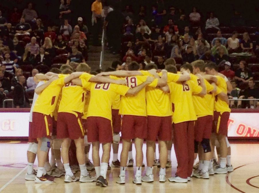 The+2014-2015+University+of+Southern+California+mens+volleyball+team+huddles+during+a+game+against+Brigham+Young.+The+USC+team+included++Micah+Christenson%2C+starting+USA+setter.+