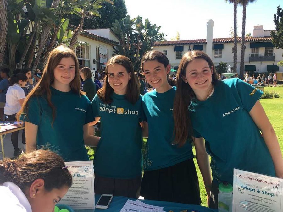 Maren OSullivan 18, Sandy Frank 19, Eden Motzkin 19, and Maddie Jacobson 19 pose at their booth for the Found Animals Foundation at the 2016 Community Service Fair. This booth was for the Adopt&Shop program at the foundation. 