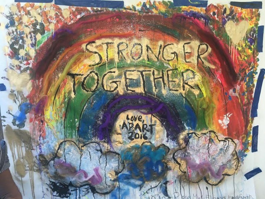 The AP Studio Art class displays their mural in the courtyard gallery. The focal point of the piece is the phrase Stronger Together, which became a major slogan of Hillary Clintons presidential campaign. 