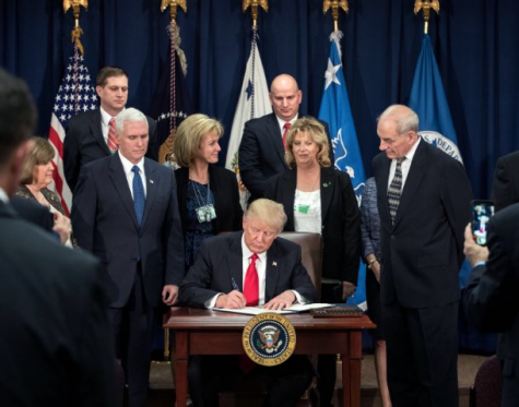President Donald Trump signs an Executive Order that prevents citizens from seven predominantly Muslim countries from entering the United States. Image Source: Whitehouse.org/facebook 