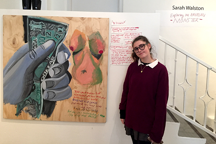 Sarah Walston at her senior showcase titled Exploring the American Monster. She addressed issues such as racism and sexism in her art. 
