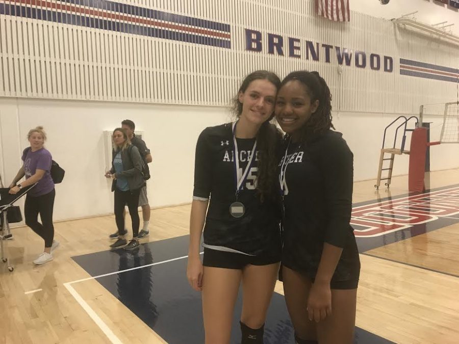 Seniors Rachel Boehm and Cydney Davis pose after placing third at the Brentwood Tournament. The varsity volleyball team sees energy as their key to success. 