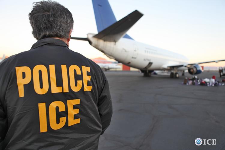 An U.S. Immigration and Customs Enforcement [ICE] employee watches a plane. ICE Acting Director Tom Homan released a statement condemning Californias recent law, calling it wrong. Image source: ICE. 