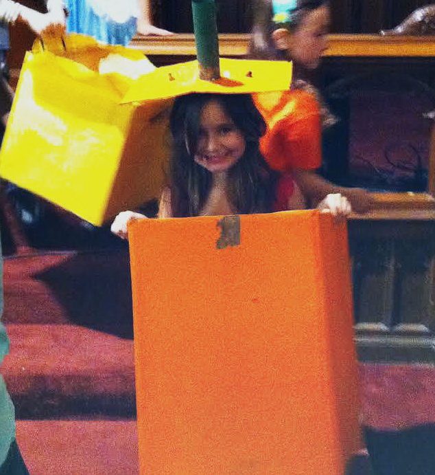 Me in second grade​, where I played the illustrious square pumpkin. My homemade costume was boo-tiful, dont you think? Image courtesy of Levin.