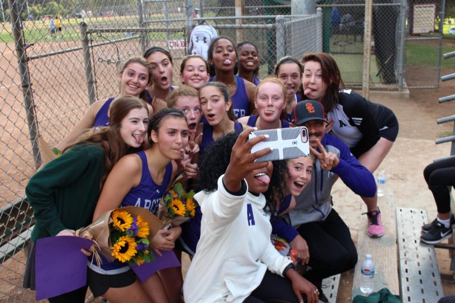 The varisty cross country team poses for a selfie with their coaches. The team celebrated Senior Night on Nov. 1 during League Finals at Cheviot Hills. 