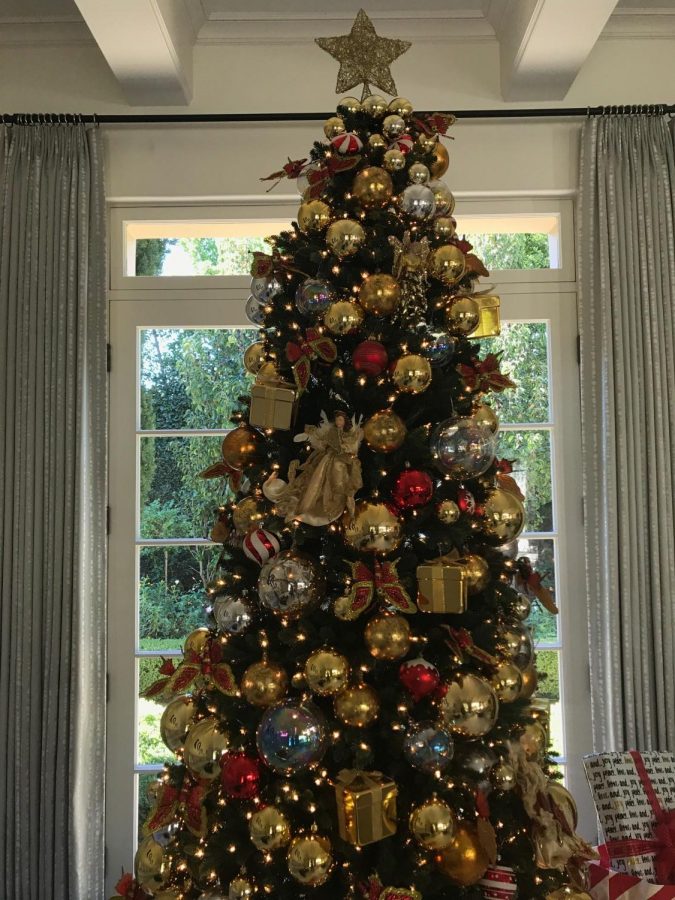 A Christmas tree stands in a living room. This holiday season, Chang recommends nine of her favorite holiday movies. 