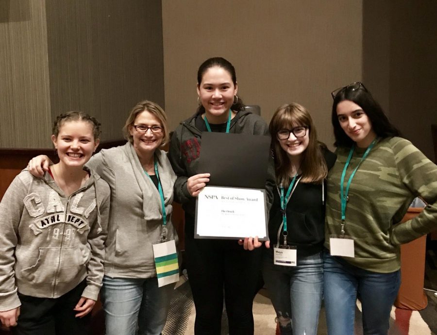 Grace Dieveney 21, adviser Kristin Taylor, Cybele Zhang 18, Maya Wernick 18 and Nelly Rouzroch 18 collect our fourth place award at the JEA/NSPA conference. This years convention was held in Dallas and had the theme Go Big. Image courtesy of Taylor.