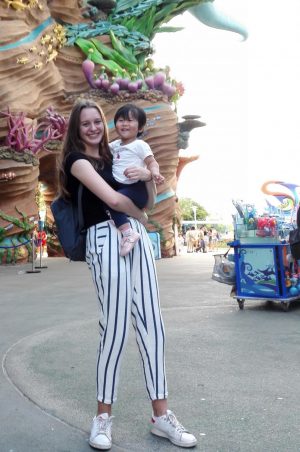 Abigale Lischak 20 poses with her host sister Muyi Yu at Chimelong Ocean Kingdom Amusement Park.  Lischak also had a host mom and dad, who she lived with during the trip. 