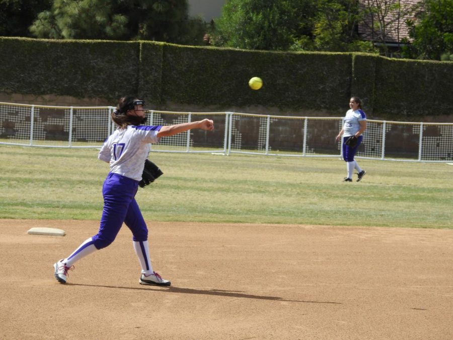 Junior Michele Chung and senior Josie Euyoque-Garcia warm up. The photo was taken on the Archer softball field last year before construction began. Image courtesy of Garcia-Euyoque. 