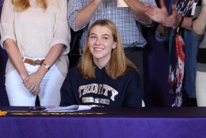 Locke Luhnow ‘18 smiles after signing her National Letter of Intent. Luhnow is Archer‘s second ever volleyball recruit.
