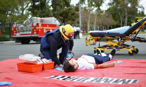 A LAFD firefighter treats a victim during a simulated school shooting drill. In order to prevent more school shootings, federal laws need to be created to limit access to firearms. Image source: 
LA County Fire Department .