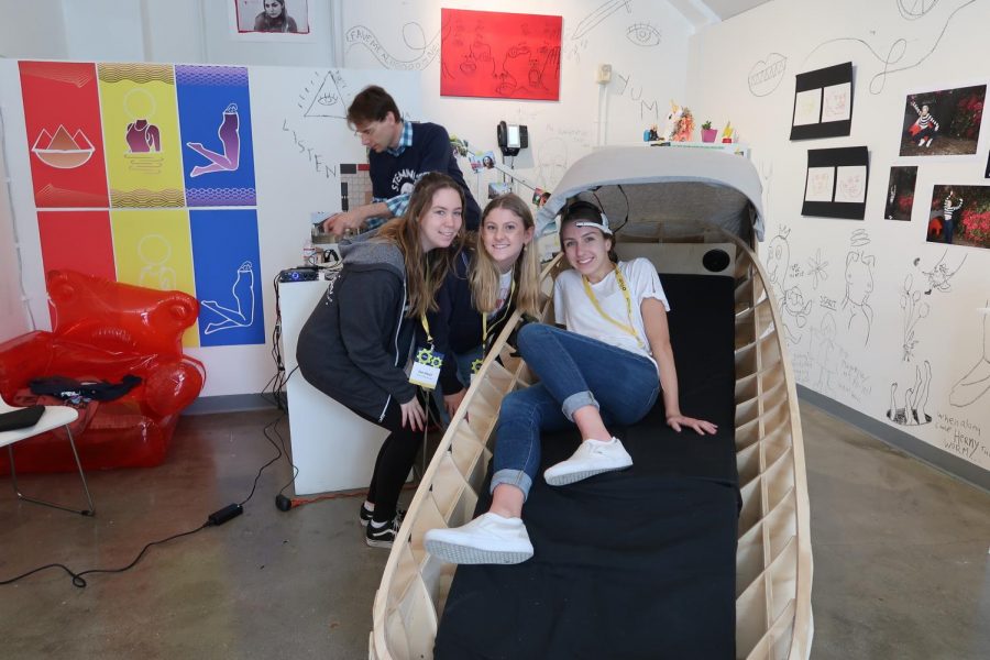 Zoe Woolf 19, Sage Brand-Wolf 19 and Ella Salomon 19 pose with their Archer Biofeedback Chair. The students created the chair in the Idea Lab for Engineering and Design class.