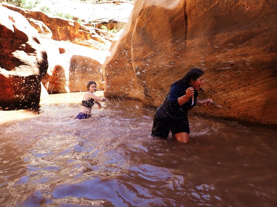 Seventh grade students Sofia DAddario and Annabelle Terner splash in the water of a Utah canyon. This image won the photo competition.