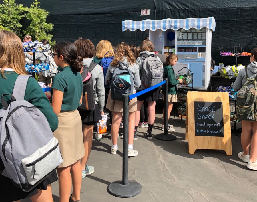 Students line up to purchase snacks at the Snack Shacks opening. 