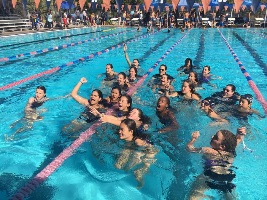Archers middle school swim team celebrates after winning the PBL championships at Brentwood school. The team won the PBL championship with 242 points. I know I practice fairly frequently so it feels good to have it pay off, eight grader Lily Prokop said.