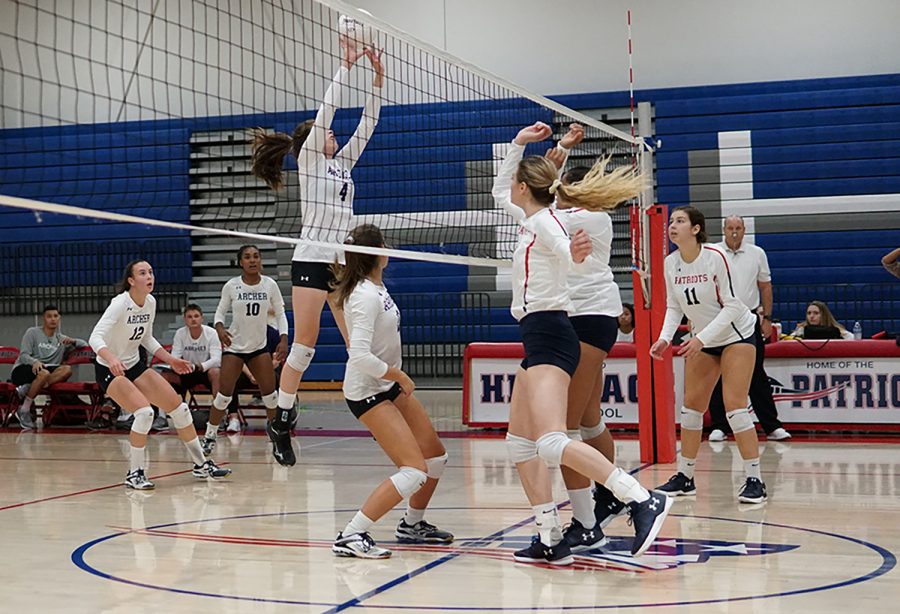 Sophomore Ava Salomon blocks a hit from Heritage. The team will play Beaumont High School this Saturday. 