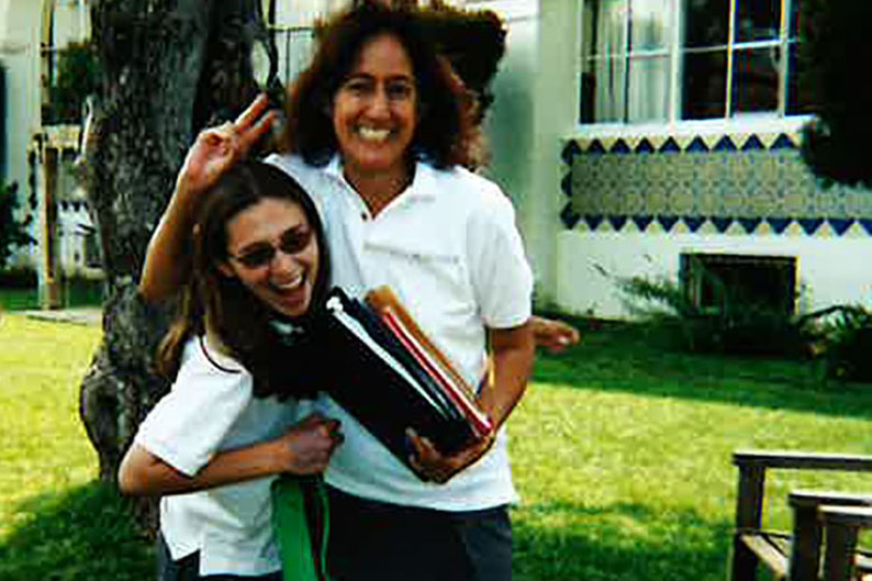 Bahedry poses in the courtyard with her history teacher, who had dressed up as an Archer student. Bahedry graduated in the class of 2005 and later returned to teach at Archer.