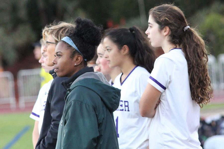 Watching from the sidelines, head soccer coaches Kim Smith and Amelia Mathis observe a varsity soccer game against the Brentwood Eagles on Dec. 6. Smith is currently serving as Acting Athletic Director of the upper school, while Mathis is filling the equivalent postition for the middle school.