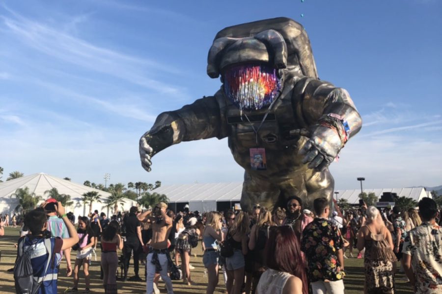 Overview effect, a massive sculpture of an astronaut, looms over festival-goers as they snap pictures or head to their favorite artists set. This installation was created by Poetic Kinetics.