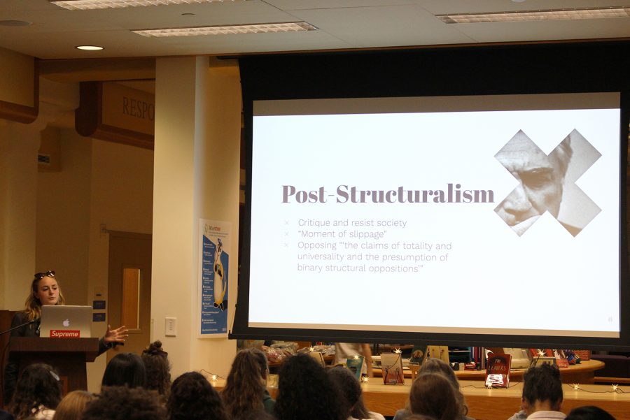 Senior Emma Golden presents her Humanities Honors Symposium research to fellow classmates and faculty in the library on May 24. There was a closing discussion including all the presenters at 2:20 p.m. in the library after the event ended. 
