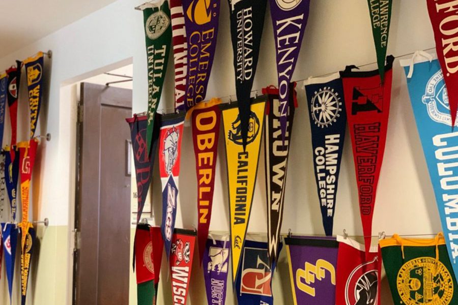 College pennants from the class of 2018 hang in the downstairs hallway. Many juniors are under stress as they begin the college process. 