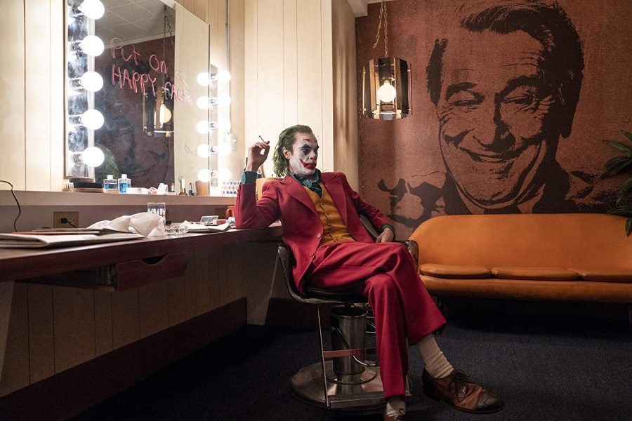 Arthur Fleck (Joaquin Phoenix) prepares for his first television appearance in Joker. The film sparked a heated debate on the medias treatment of mental health, gun violence, and other issues, but ultimately was attempting to dramatize our society rather than glamorize these topics. Photo courtesy of Joker promotional  materials. 