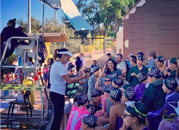 Head Coach Stephanie Ferri advises the Middle School swimmers. The swim team was undefeated this season. Photo courtesy of Archer Athletics Instagram.  