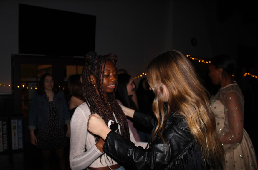 Chidimma Nwafor 22 and Ava Rothenberg 22 dance in the dinning hall at the sophomore Archer dance on Jan. 24. 