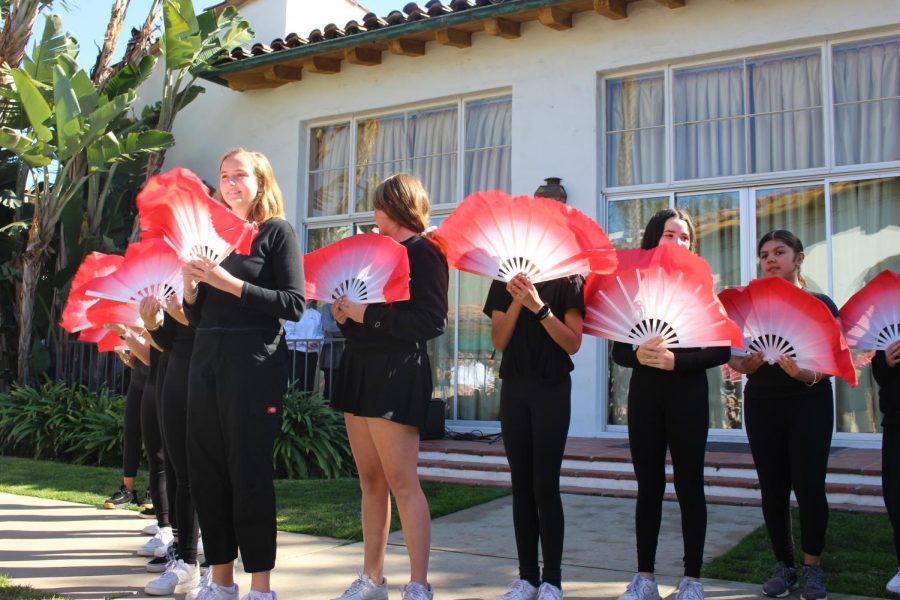 Chinese class 1B participates in a fan dance choreographed by eighth and eleventh grade Chinese students. Along with the fan dance, classes also participated in a skit and song.  